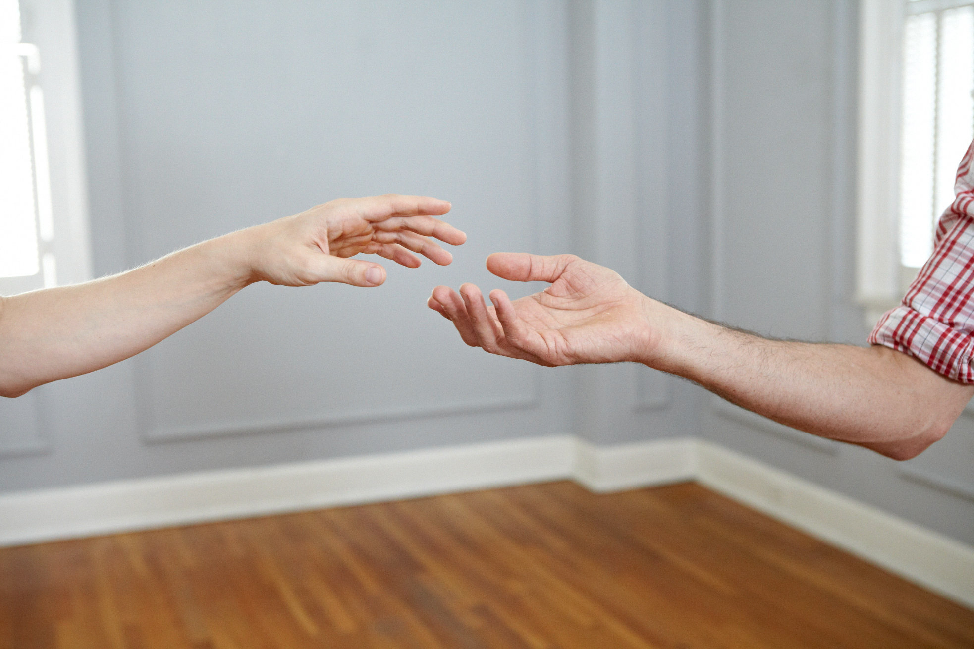 Hands raised in welcome, symbolizing connection